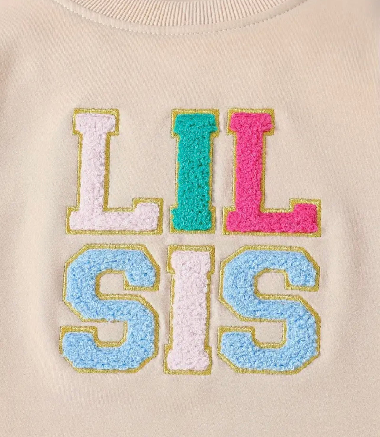 Adorable 'Lil Sis' long-sleeve romper for 12-18 months, featuring soft fabric and cute design.