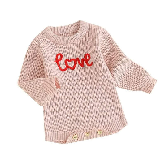 Baby girl wearing love embroidered knit romper for spring.