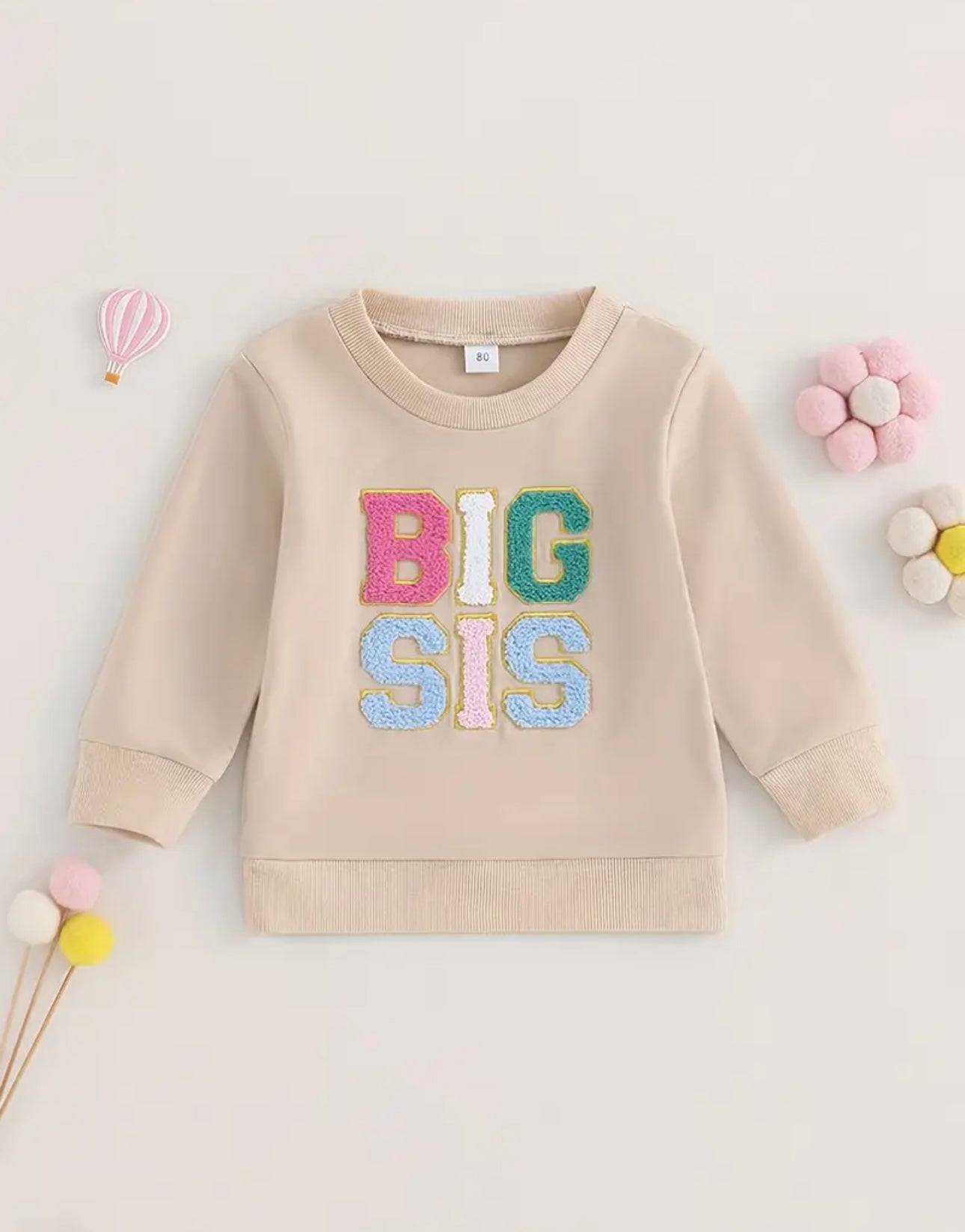 Big Sis Pullover in beige with colorful embroidered letters, perfect for big sisters, displayed with soft cotton blend fabric and classic crew neck design