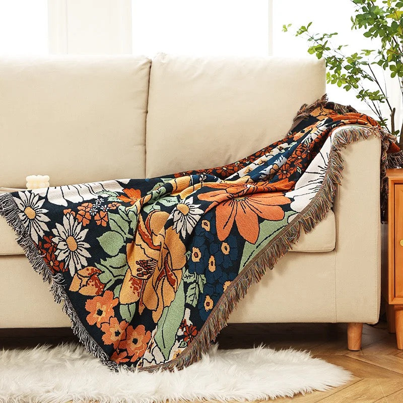 Boho-inspired Penny Lane blanket with vintage floral design in warm tones, perfect as a cozy throw, bohemian home decor, or a versatile picnic rug.