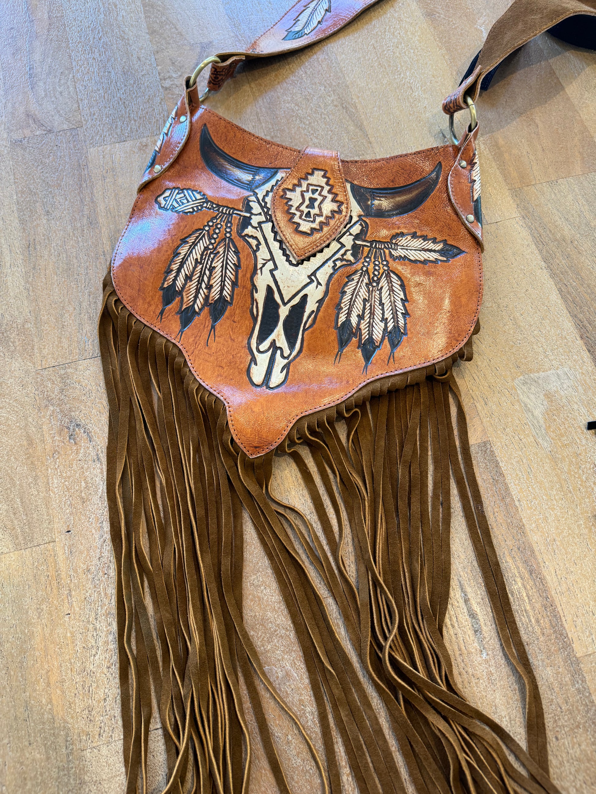 Close-up of the Boho Bronco Bag's adjustable strap and zip closure, highlighting its Western-inspired design.