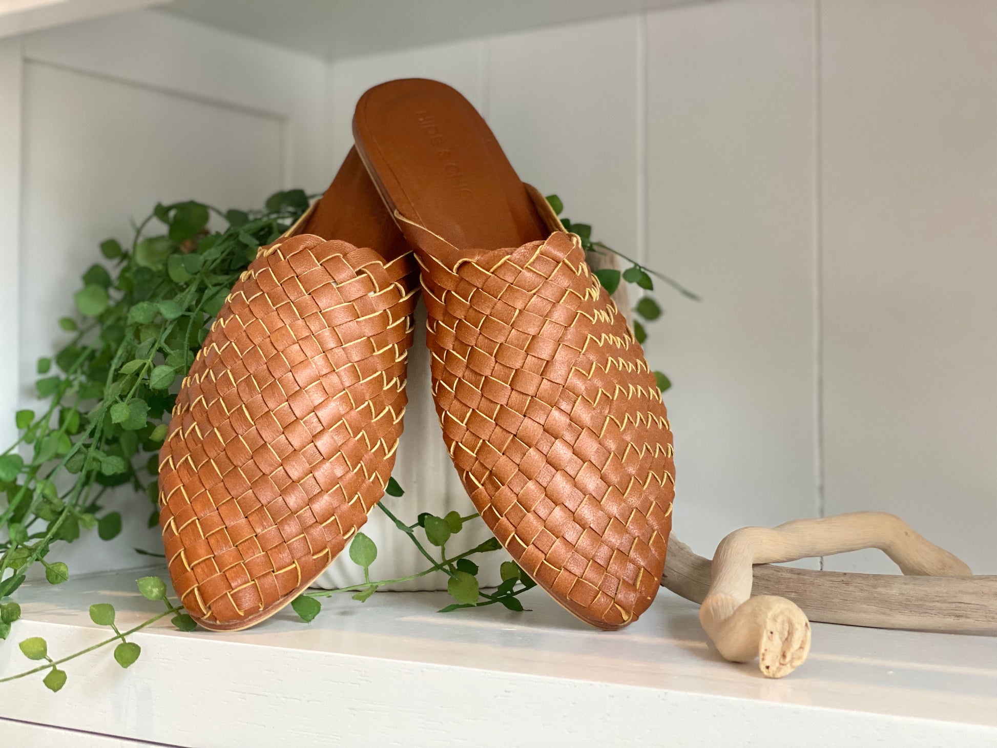 Stylish Dark Biscuit leather mules with a pointed toe and closed toe woven pattern, offering a chic boho flair and a secure fit with a non-slip rubber sole.