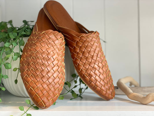 Dark Biscuit leather woven slide sandals with a pointed toe, featuring a closed toe design and non-slip rubber sole, perfect for adding boho flair to your work wardrobe.