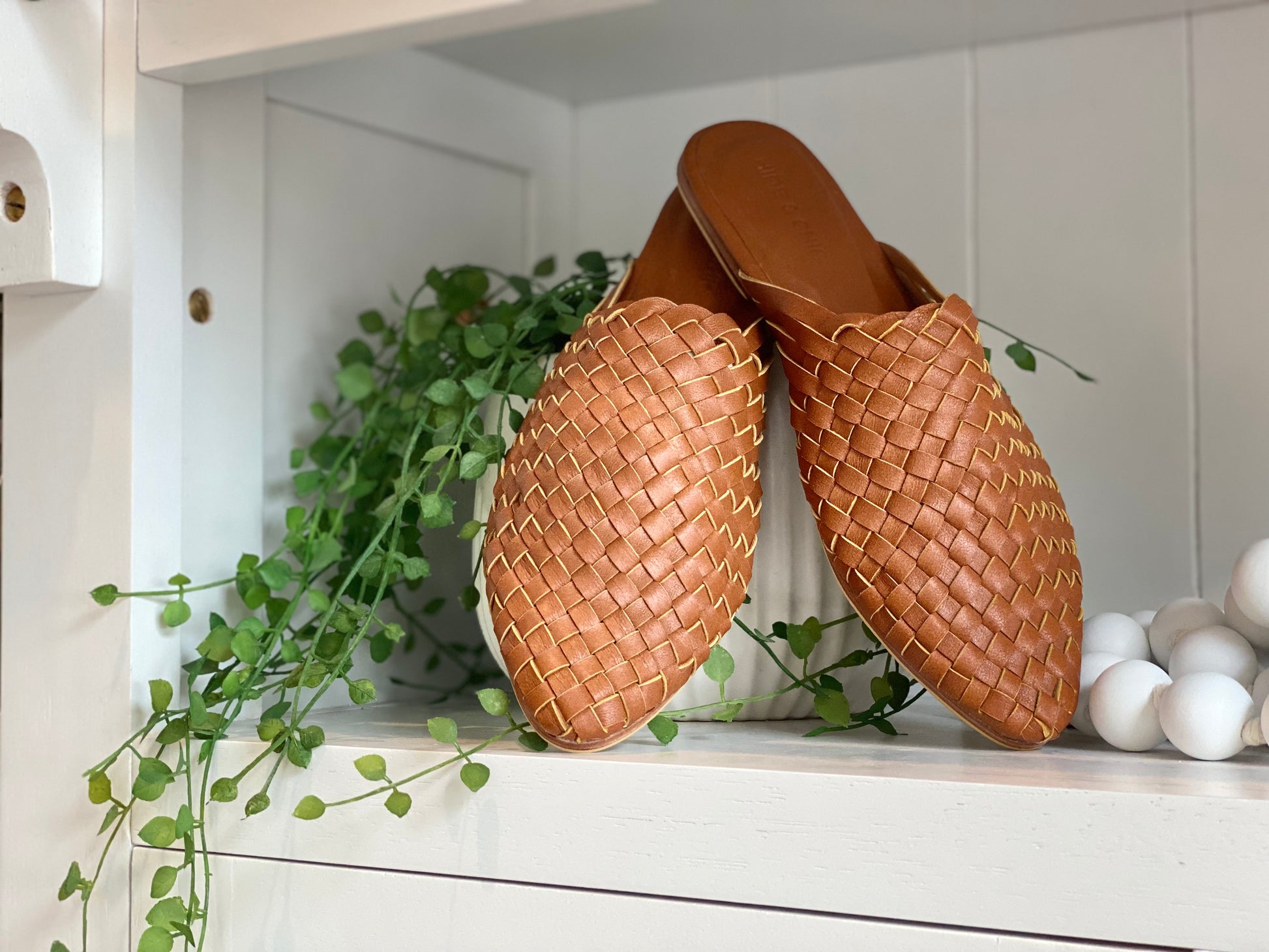 Dark Biscuit pointed toe mule sandals with a woven leather design and closed toe, offering a slim fit and comfortable non-slip rubber sole for a chic, boho-inspired style.