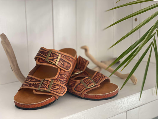 Discover Sahara Tooled Leather Sandals: handcrafted, comfortable women's leather sandals made from genuine leather with a cork-molded sole, perfect for casual outings!