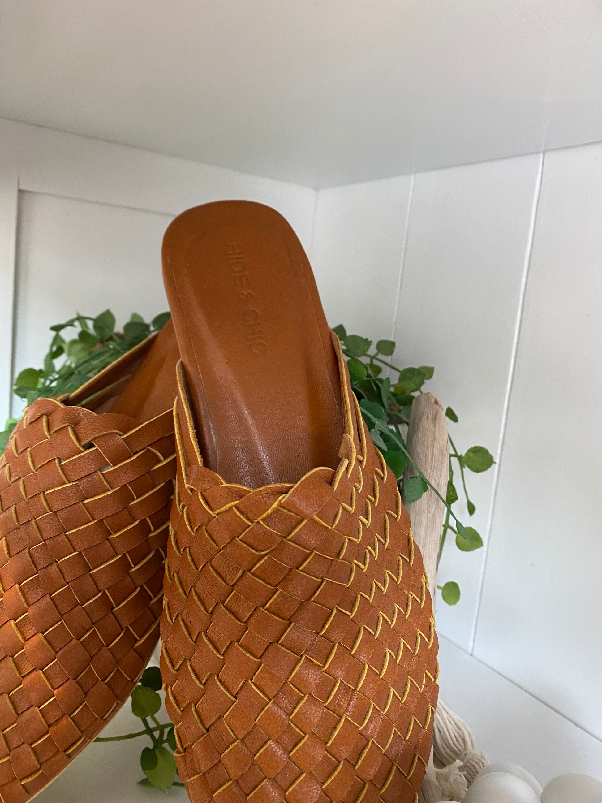 Elegant Dark Biscuit pointed toe mules with woven leather detail and a closed toe design, combining boho charm with a comfortable non-slip rubber sole for everyday wear.