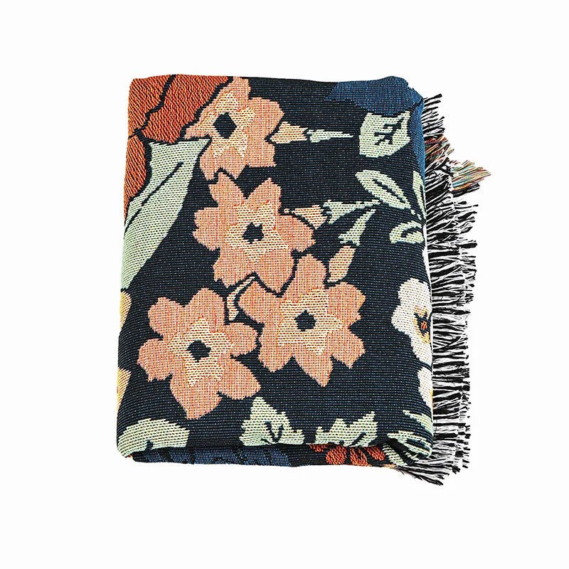 Boho-inspired Penny Lane blanket with vintage floral design in warm tones, perfect as a cozy throw, bohemian home decor, or a versatile picnic rug. tassel ends