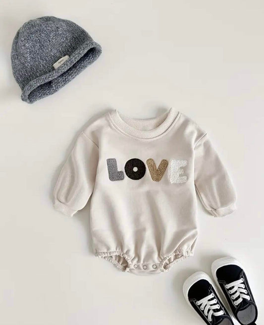 Grey love slogan romper for baby, perfect for cooler days.