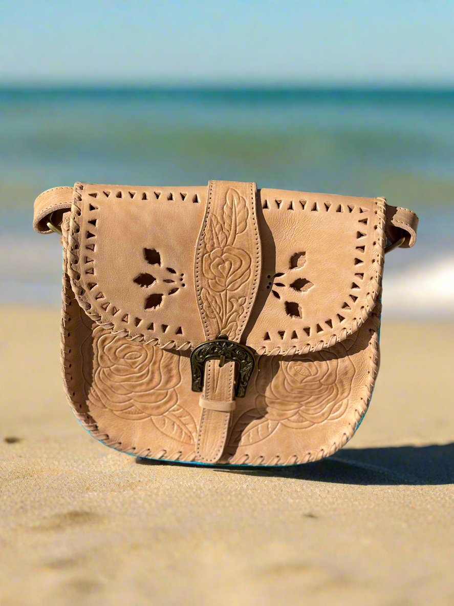 Hand-tooled leather shoulder bag with floral design, "Desert Rose," vintage-inspired, boho-style bag.