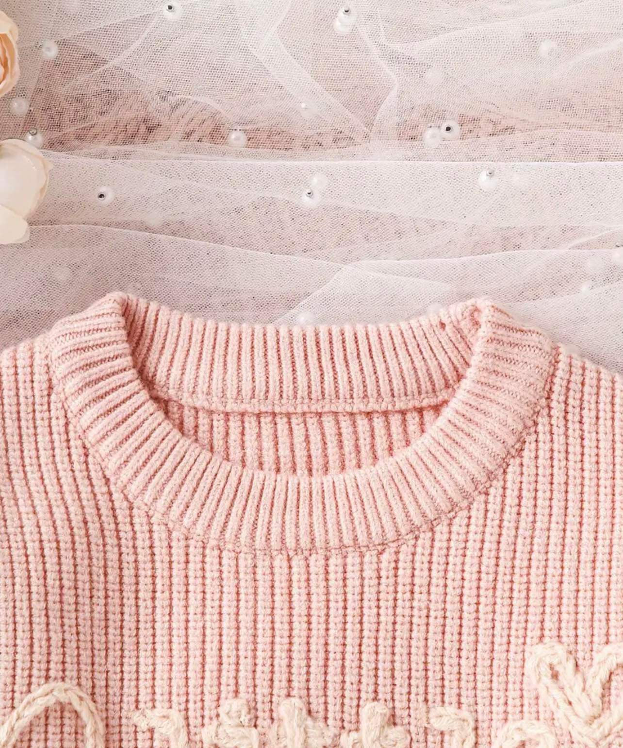 Little Love Knot Knit Sweater, highlighting the chunky knit texture and letter embroidery. The pullover is easy to match with other fall and winter clothing and is a great gift for special occasions.