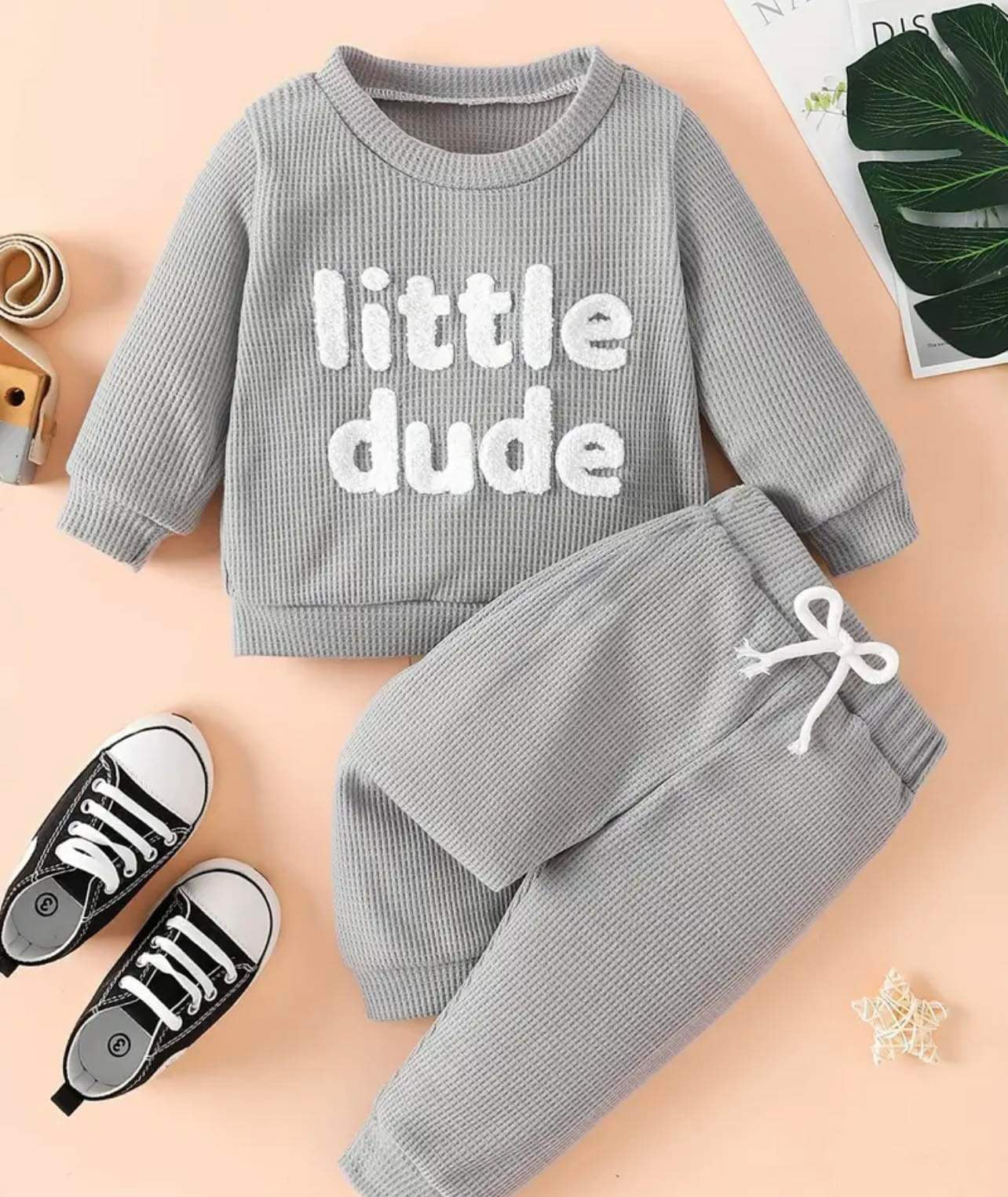 Baby boy in a grey Little Dude Set, featuring a cozy sweater and elastic waist pants.