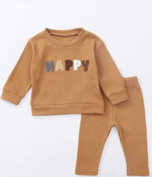 Unisex caramel kids tracksuit set with 'HAPPY' embroidered on long sleeve sweatshirt and matching pants.