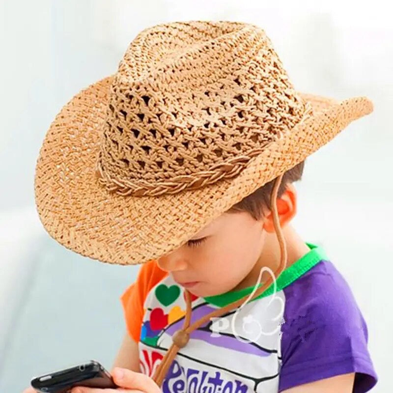 Young boy wearing the Tumbleweed Rancher cowboy hat, enjoying outdoor activities in the summer sun.