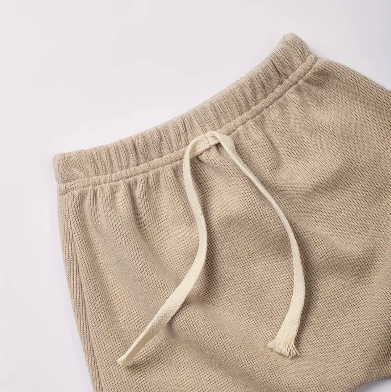 Close-up of the soft, slouch pants from the Sunset Set Kids comfortable tracksuit, crafted in breathable organic cotton.